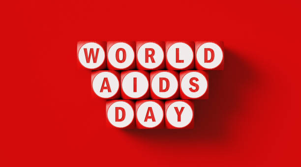 día mundial del sida escribió woodblocks sentados en fondo rojo - world aids day fotografías e imágenes de stock