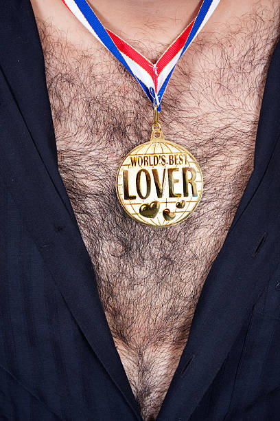 World best lover World best lover medal on a hairy male chest macro body hair stock pictures, royalty-free photos & images