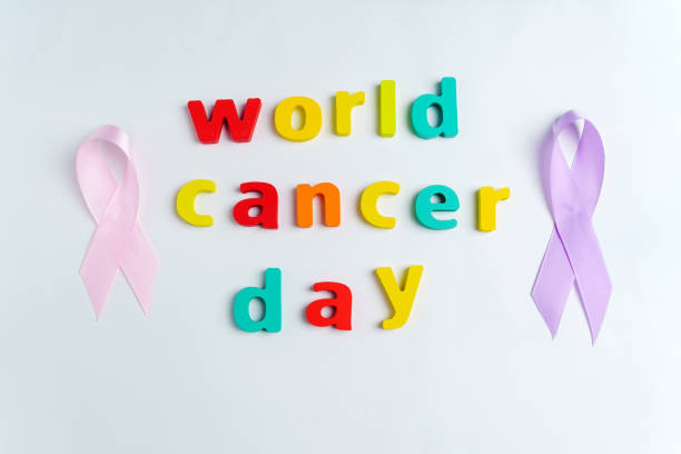 World Cancer Day, to raise awareness of all types of tumors supporting people living with diseases. Top view. White background. stock photo