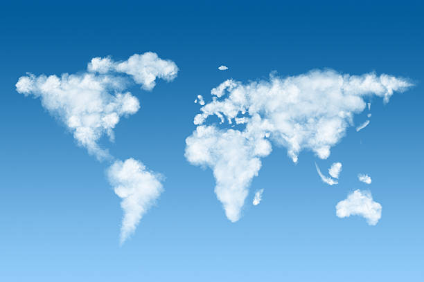 world map made of white clouds on sky stock photo