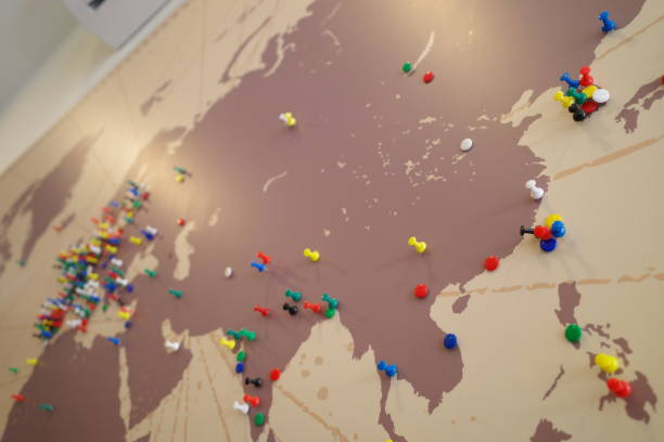World map with dotted colorful pins stock photo