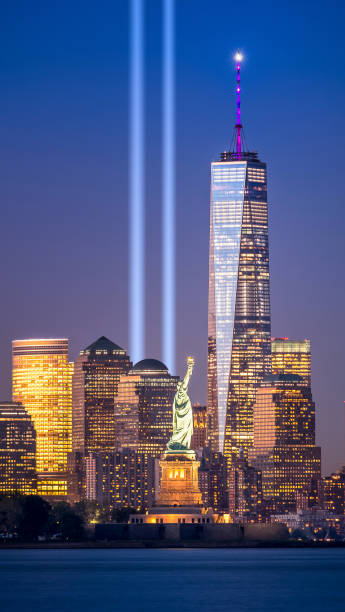 World Trade Center with Statue of Liberty on the foreground World Trade Center with Statue of Liberty on the foreground blue hour twilight stock pictures, royalty-free photos & images