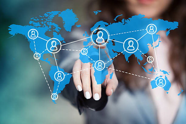 Worldwide team building. Businesswoman connecting worldwide social network scheme on virtual touch screen. call center outsourcing stock pictures, royalty-free photos & images