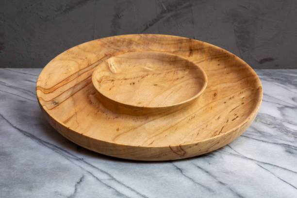 Wormy wood nut bowl and serving bowl stock photo