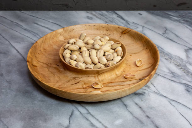 Wormy wood nut bowl and serving bowl stock photo
