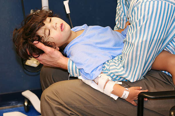 Worn out little boy in ER stock photo