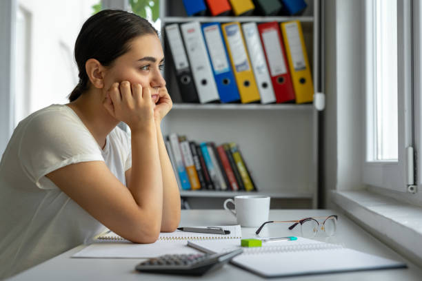 Worried female student at home Worried female student at home hardest exams stock pictures, royalty-free photos & images