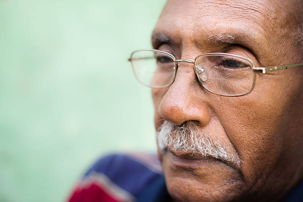 Worried senior african american man with eyeglasses Senior people and feelings, portrait of sad old black man with glasses and mustache. Copy space sad old black man stock pictures, royalty-free photos & images
