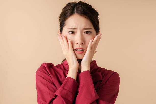 Worried young asian woman. Facial expression. Worried young asian woman. Facial expression. one young woman only stock pictures, royalty-free photos & images