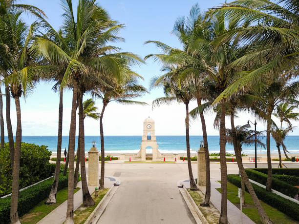 Worth Avenue Clock Tower on Palm Beach, FL During COVID-19 Worth Avenue Clock Tower on Worth Avenue, Palm Beach, Florida in the Spring of 2020 during the COVID-19 pandemic. No people due to beach closures & stay home order. avenue stock pictures, royalty-free photos & images