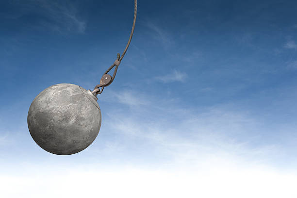 wrecking ball represents fed rate hikes affecting cryptos