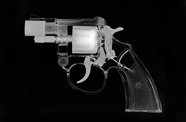 X-ray gun X-ray style image of a toy Colt Detective Special revolver jay barker stock pictures, royalty-free photos & images