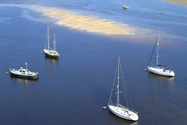 Yacht Moorings In Tidal Estuary stock photo