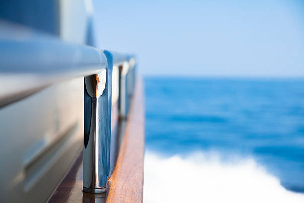 Yacht Sailing. High speed. Hand Rails. Close-up.  Sea. Waves. stock photo