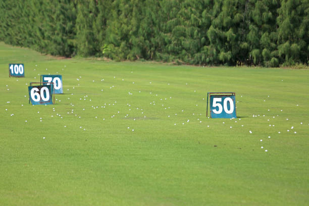 Yard signs in driving range golf course Yard signs in driving range and golf ball in golf course 100 yard stock pictures, royalty-free photos & images