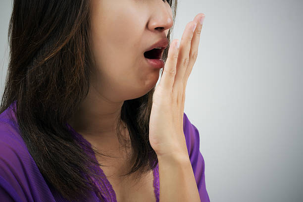 Yawning Yawning tired woman bad breath stock pictures, royalty-free photos & images
