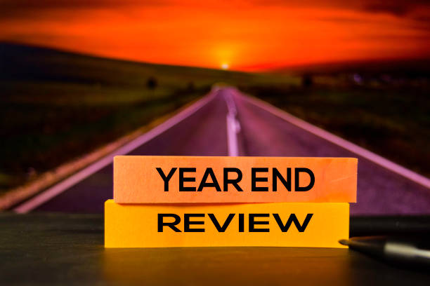 Year End Review on the sticky notes with bokeh background Year End Review on the sticky notes with bokeh background the end stock pictures, royalty-free photos & images