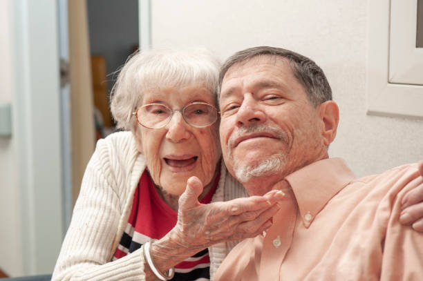 105 Year Old Woman Hugs Her Nephew stock photo