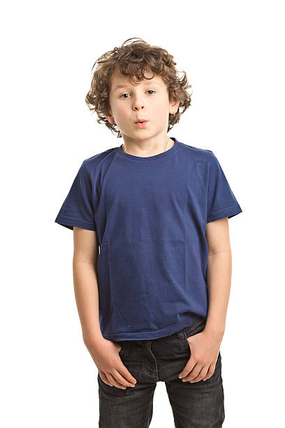 7 years old boy in tshirt whistling stock photo