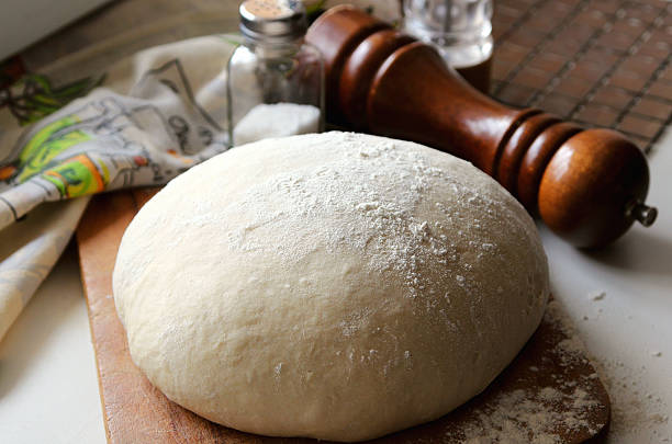 Yeast dough lying on the board. stock photo