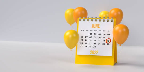 Yellow 19th June Father's Day desk calendar 2022 with ballons on blank background with copy space. stock photo