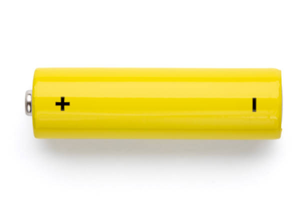 Yellow AA alkaline battery on white background stock photo