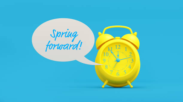 Yellow Alarm Clock and Spring Forward Written White Speech Bubble on Blue Background Yellow alarm clock and spring forward written white speech bubble on blue background. Reminder concept. Horizontal composition with copy space. daylight saving time stock pictures, royalty-free photos & images