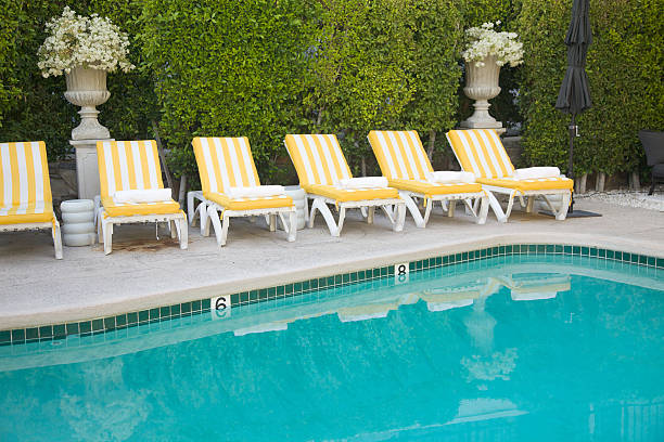 Yellow and White Striped Pool Furniture, Leisure, Summer, Relaxation stock photo