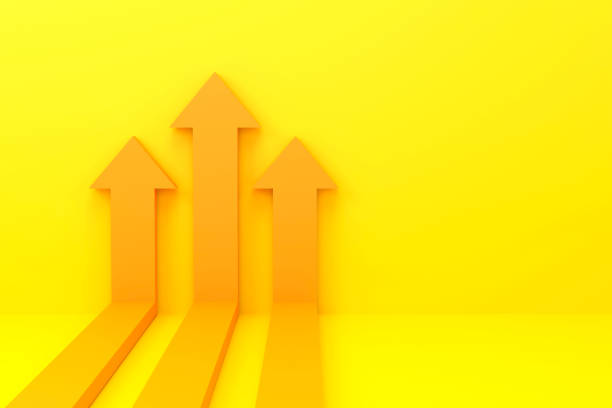yellow arrows rising on the wall, growth chart or graph investment - booming economic growth breaking record stock photo