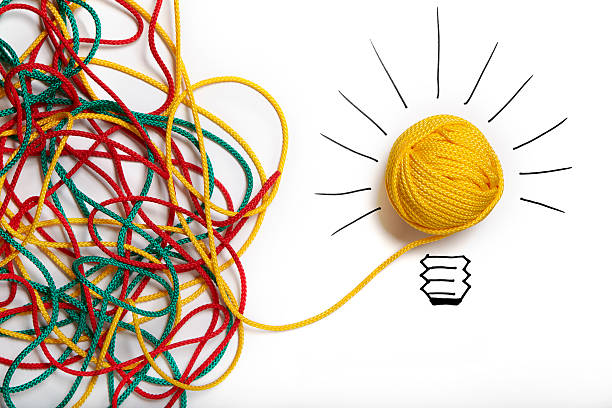 Yellow ball of wool with pen lines like lightbulb  complexity stock pictures, royalty-free photos & images