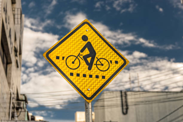 Yellow bike path signpost. stock photo