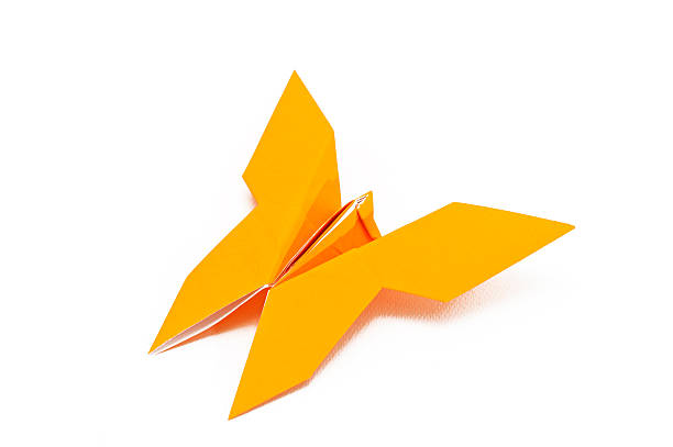 Yellow butterfly origami on white  vudhikrai stock pictures, royalty-free photos & images