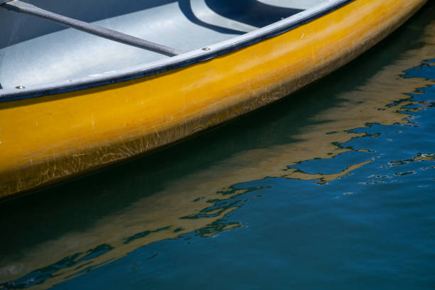 Yellow Canoe and Reflection stock photo