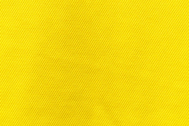 Yellow color fabric cloth polyester texture and textile background. stock photo