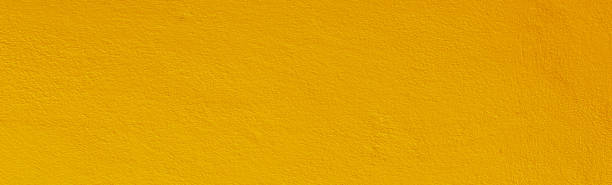 Yellow color old grunge wall concrete texture as background. stock photo