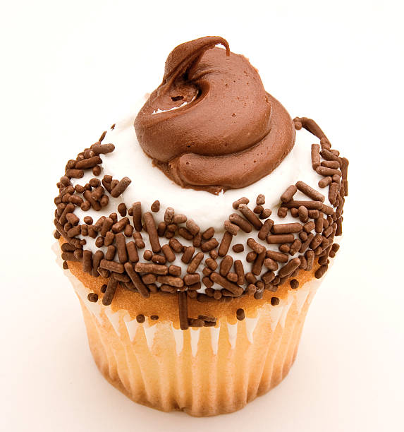Yellow Cupcake with Chocolate and White Icing stock photo