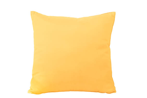 Yellow cushion isolated on a white background stock photo