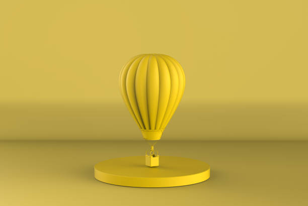 yellow hot air balloon fly on yellow background stock photo