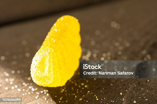 istock Yellow marmalade in sugar in the rays of light 1319006599