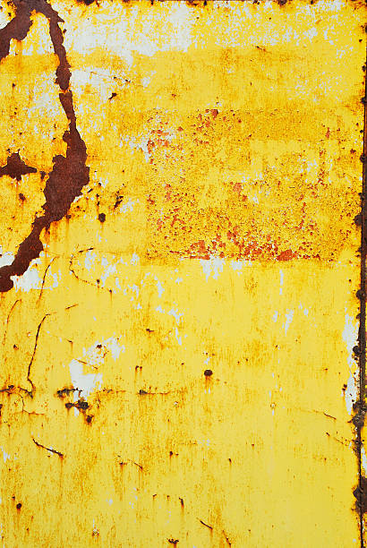 Yellow painted metal with rust texture stock photo