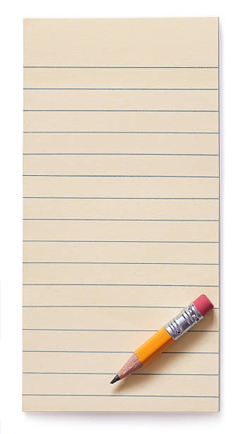 Yellow pencil on note pad isolated Photo of the yellow pencil lying on yellow sticky note pad. Isolated on white background shopping list stock pictures, royalty-free photos & images