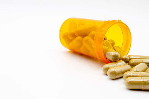 Download Yellow Pill Bottle With Green Pills Spilling Out Stock Photo Download Image Now Istock Yellowimages Mockups