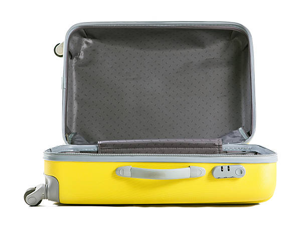 yellow suitcase isolated on white stock photo