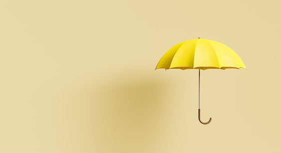 yellow umbrella on beige background with shadow and space for text. minimal autumn and winter concept. 3d rendering