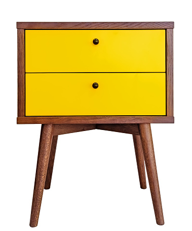 Yellow wood bedside table. Modern designer nightstand isolated on white background front view. cabinet with two drawers.