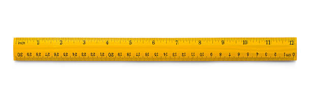 Yellow wooden ruler Picture of yellow wooden ruler isolated on white background ruler stock pictures, royalty-free photos & images
