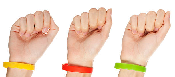 Yellow,green and red  wristbands stock photo