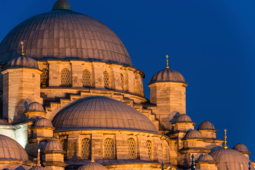 The New Mosque (Yeni Cami) lit up in late evening in Istanbul, Turkey.