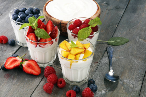Yogurt and berry. Fresh fruit yogurt with fresh berries and peaches stock photo
