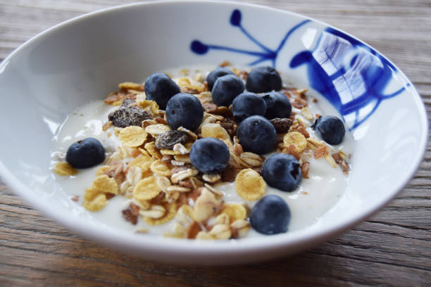 Yogurt, cereal and blueberries stock photo